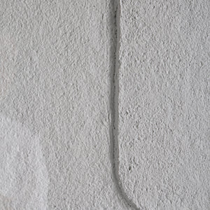 Close-up of textured white panel from Arches wall art