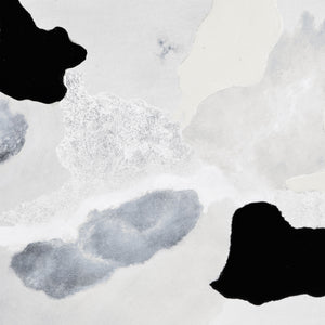 Close-up of Alasia canvas art highlighting gray, black, and silver abstract shapes.