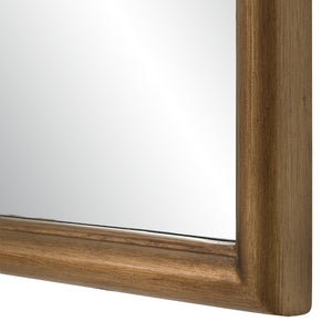 Close-up of Emilien mirror's gold-toned frame and reflective surface.
