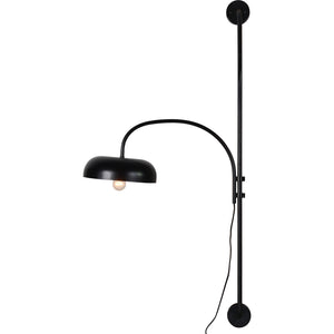 Draco Wall Sconce in black with a dome shade and visible light bulb, mounted on a wall.