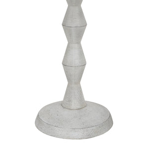 Close-up of Sorriso floor lamp's light gray geometric base and texture.