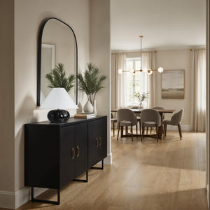 Celine Table Lamp on a black console table in a modern dining area