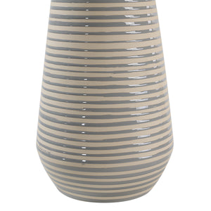Close-up of Pera Table Lamp's striped beige ceramic base