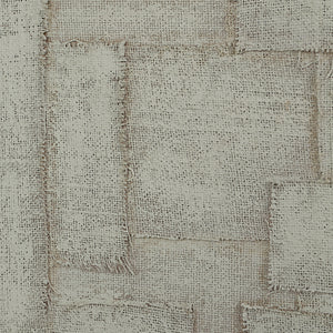 Caramelo wall art featuring textured beige fabric patches with frayed edges.