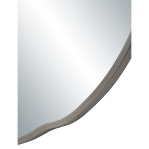 Close-up of Cerro mirror by Renwil, showcasing the wavy silver frame and reflective glass.