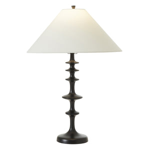 Petrus table lamp featuring a black base and illuminated white shade, highlighting its elegant shape.