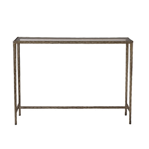Nara console table with a glass top and textured metal frame in a silver finish.