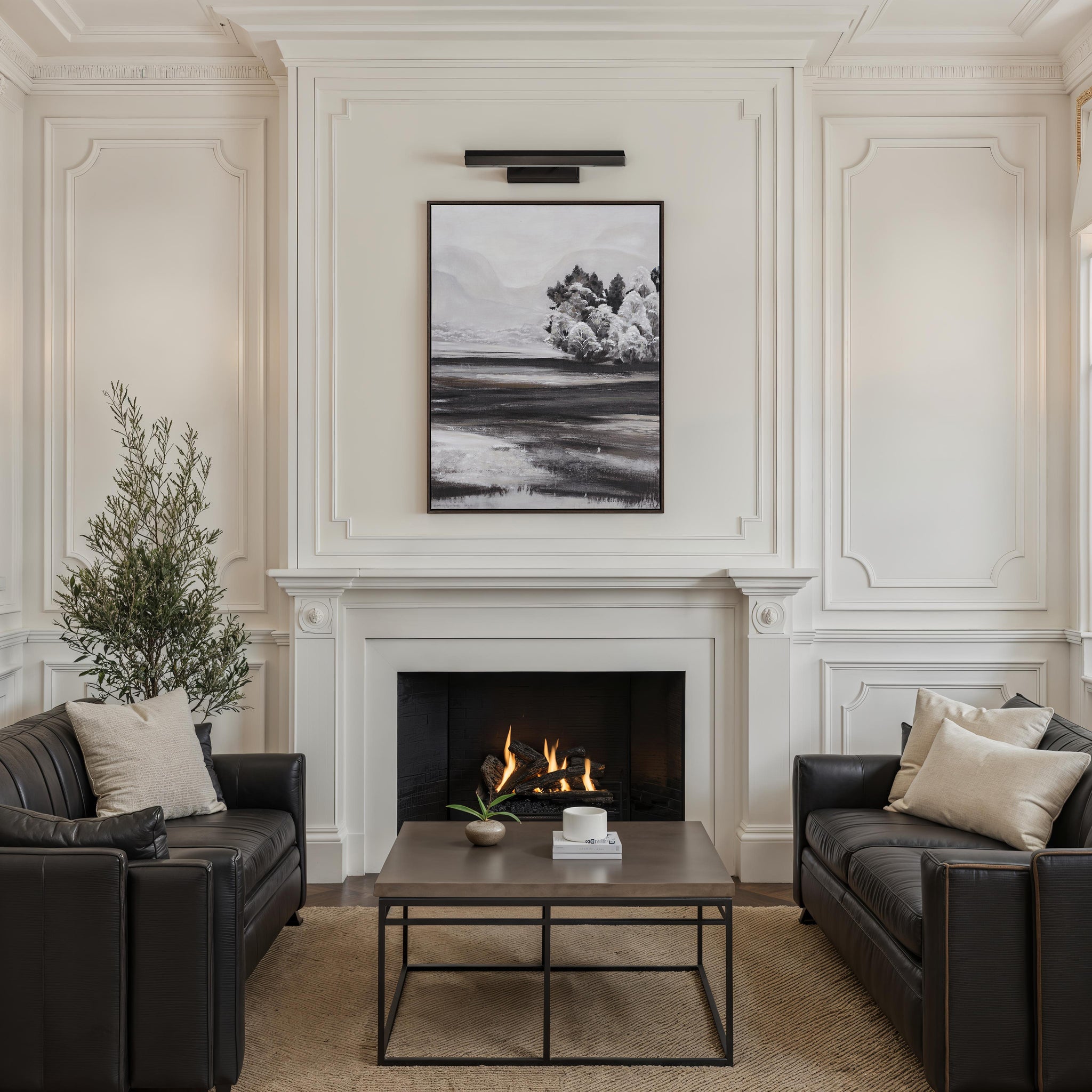 Nea wall sconce by Renwil installed in a stylish living room above a fireplace.