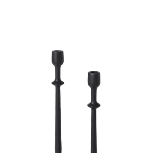 Detail view of two black Albero Candle Holders, emphasizing their unique shapes and heights.