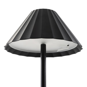 Giada Table Lamp by Renwil, close-up of black pleated shade, white interior, modern aesthetics