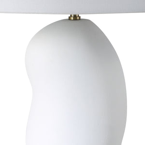 Katya Table Lamp close-up showing the white textured base and brass detail.
