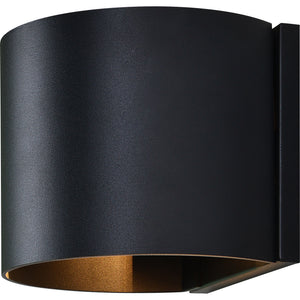 Lark Wall Sconce in black with a gold lining, showcasing a sleek curved profile.