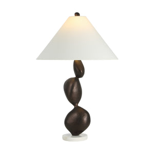 Elle table lamp by Renwil illuminated, featuring a brown sculptural base and white shade.