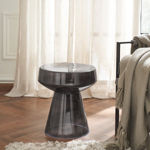 Lavanda table in a living room setting, with a dark glass finish and soft lighting.