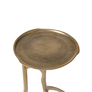 Top view of the Tosca table, emphasizing the textured gold surface and unique design.