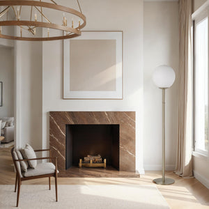 Koloa floor lamp in a modern living room setting near a marble fireplace and framed artwork.