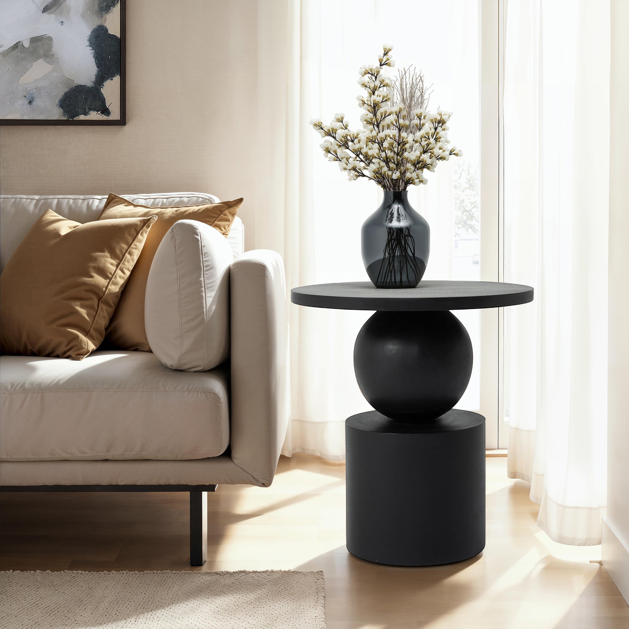 Paola side table styled with a vase and decorative elements beside a sofa.