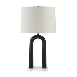 Pisa Table Lamp featuring a black arching body and white shade on a transparent acrylic base.