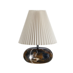 Noto Brown table lamp with a pleated cream shade and a dark marble base.