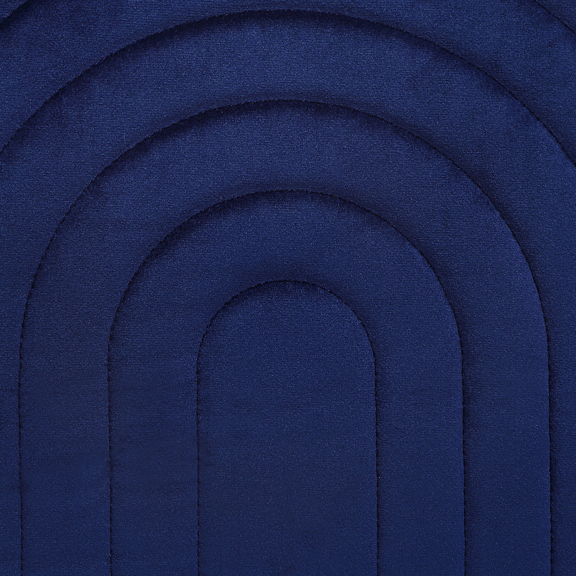 Close-up of Pichu indoor pillow featuring navy blue quilted rainbow design.