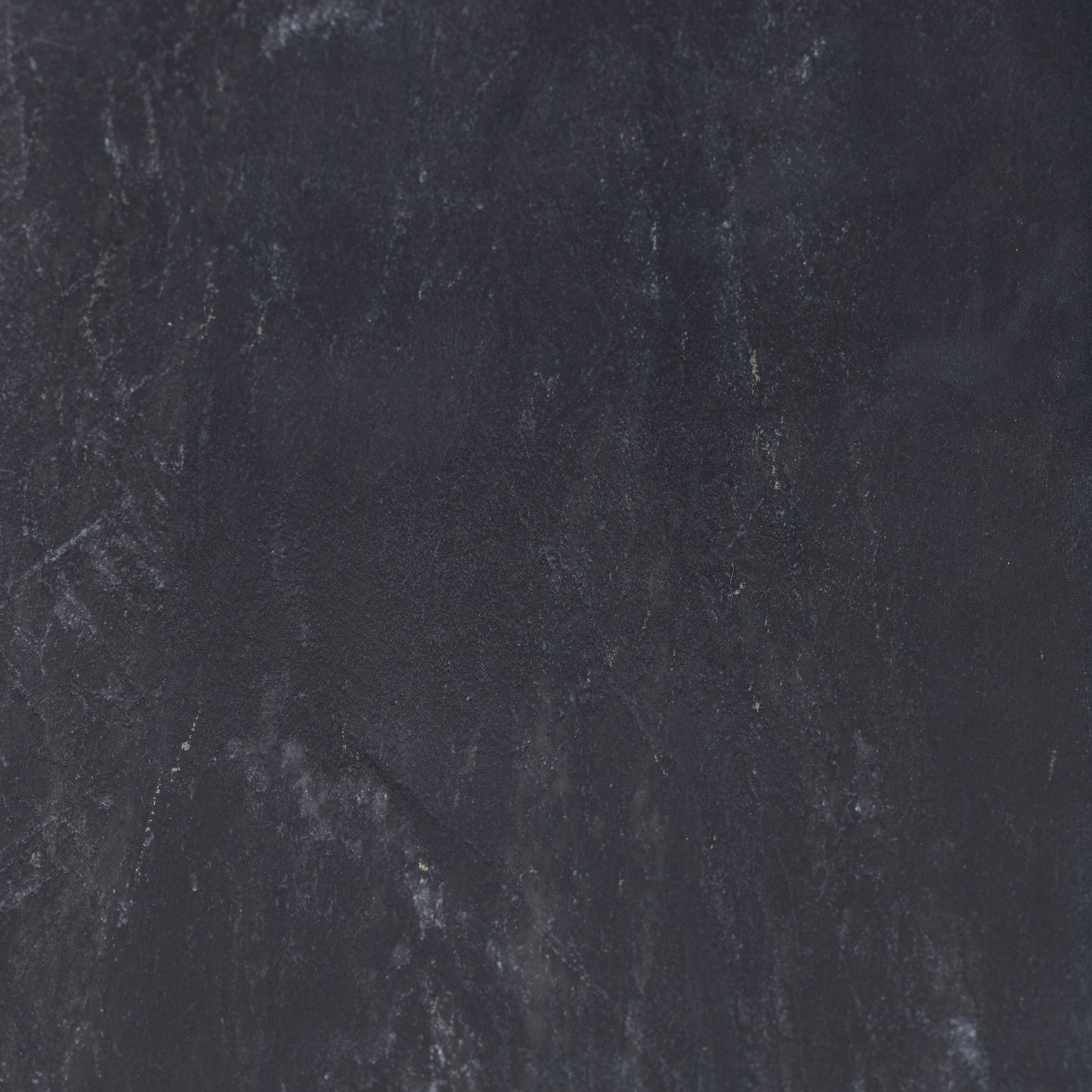 Close-up of the textured black surface of the Poema candle holder