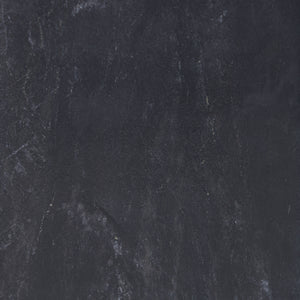 Close-up of the textured black surface of the Poema candle holder
