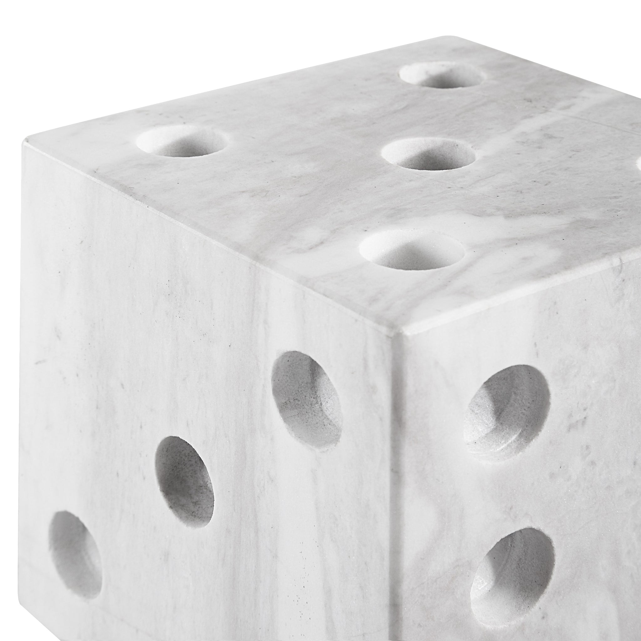 Dylon statue, close-up of white marble cube with holes, contemporary look