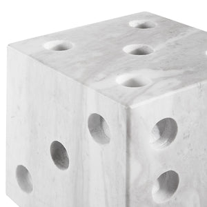 Dylon statue, marble cube featuring multiple holes, modern aesthetic