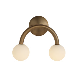 Santi wall sconce featuring a curved bronze metal arm with two frosted glass globes.