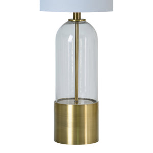 Theodore Table Lamp featuring a clear glass design and brass base, showcasing a minimalist style.