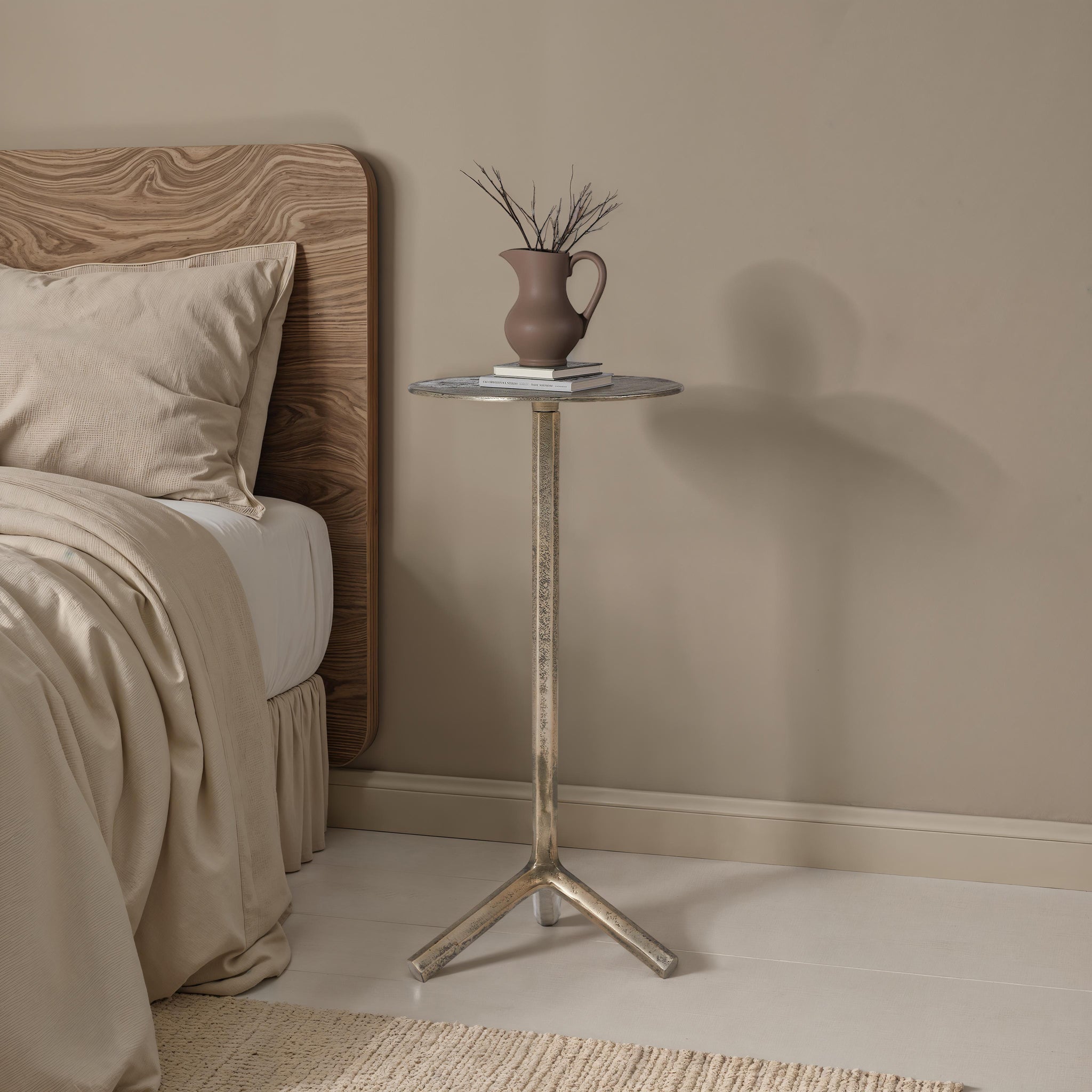 Zahra side table in a cozy bedroom setting with a decorative vase and stacked books