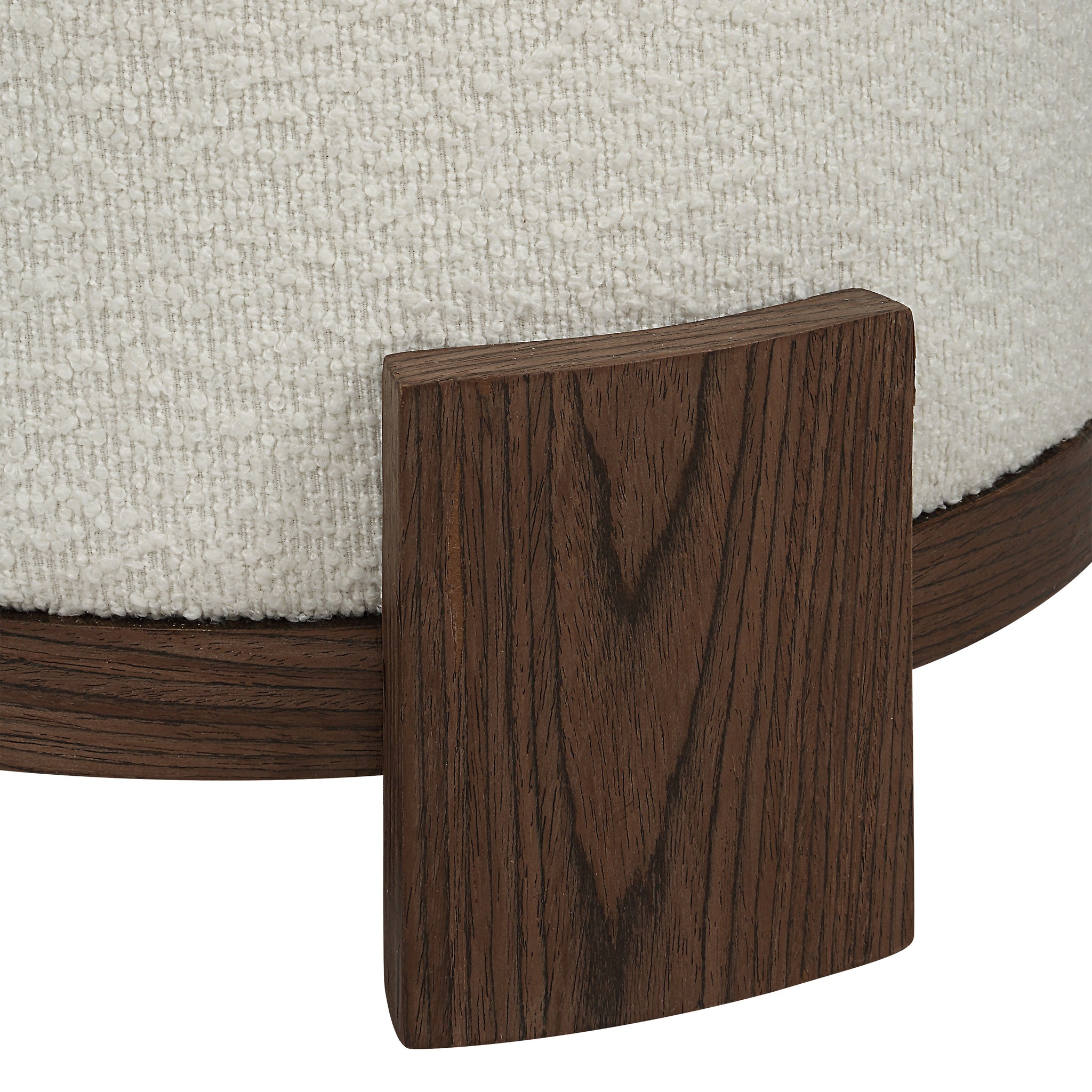 Chaves Ottoman by Renwil, close-up of dark wood base and cream textured fabric