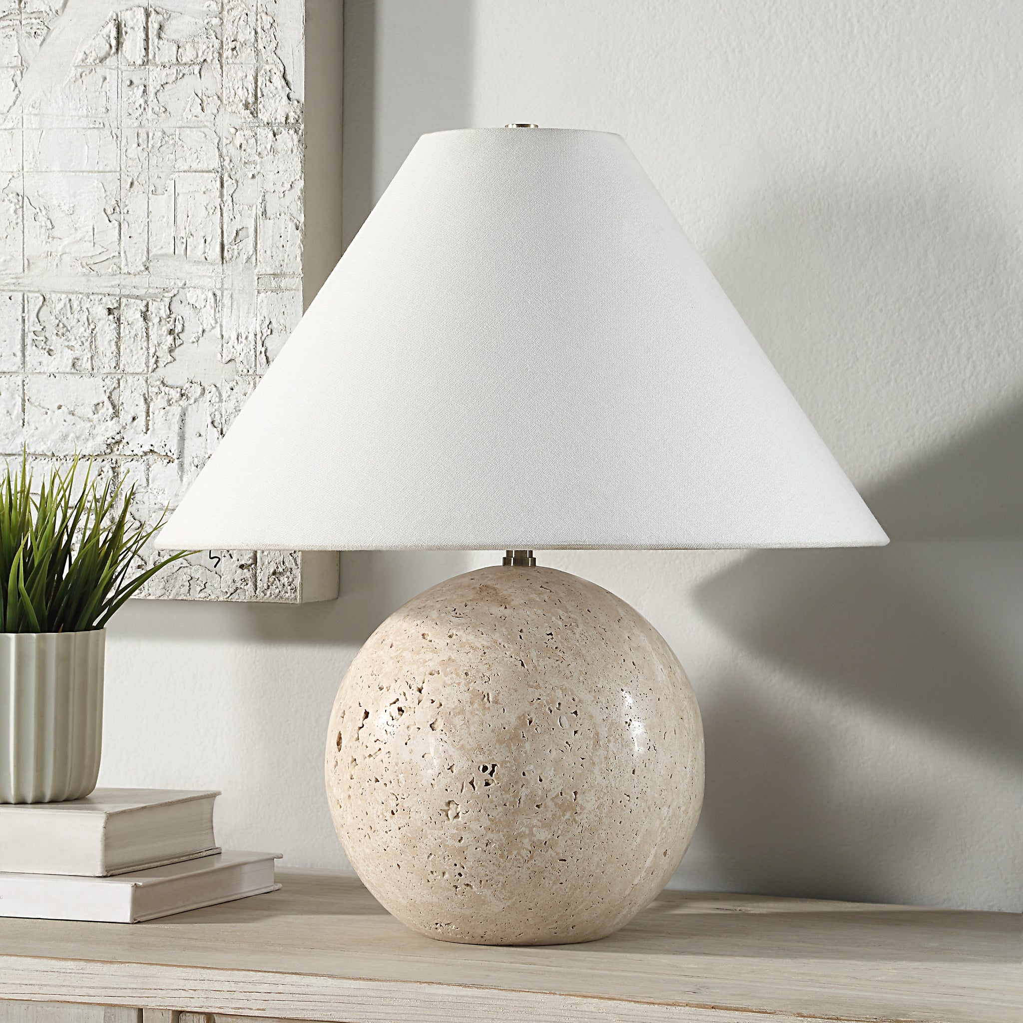 Assen Table Lamp showcasing a beige stone base and a white fabric cone shade.
