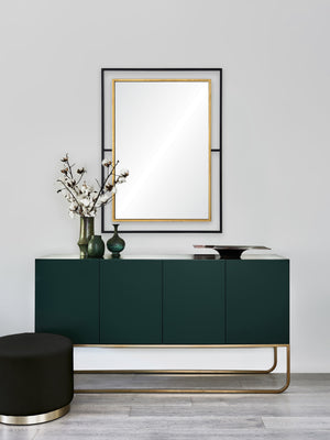 Gray wall mirror above a green cabinet, styled with decorative vases and a black stool.