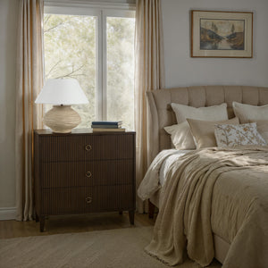 Ola table lamp by Renwil on a nightstand in a cozy bedroom setting