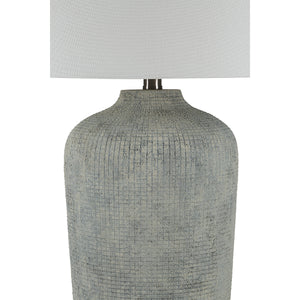 Aurelle table lamp featuring a close-up of its gray ceramic base and white shade.