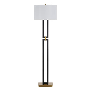 Theo Floor Lamp with a white drum shade, black metal base, and gold accent.