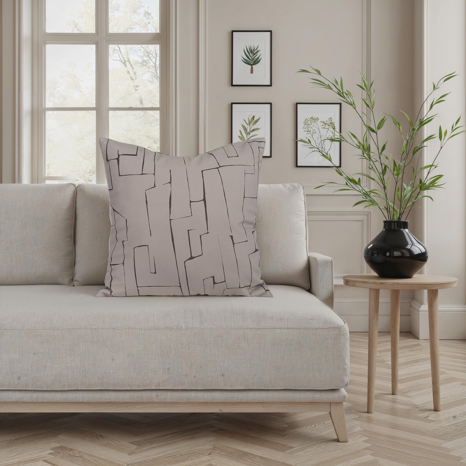 Sarno pillow with abstract geometric pattern in beige and brown tones.