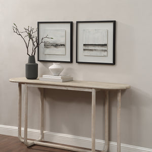 Tangelo wall art displayed above a console table with decorative items and a vase.