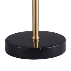 Close-up of Gillian Table Lamp's black base and gold stem.