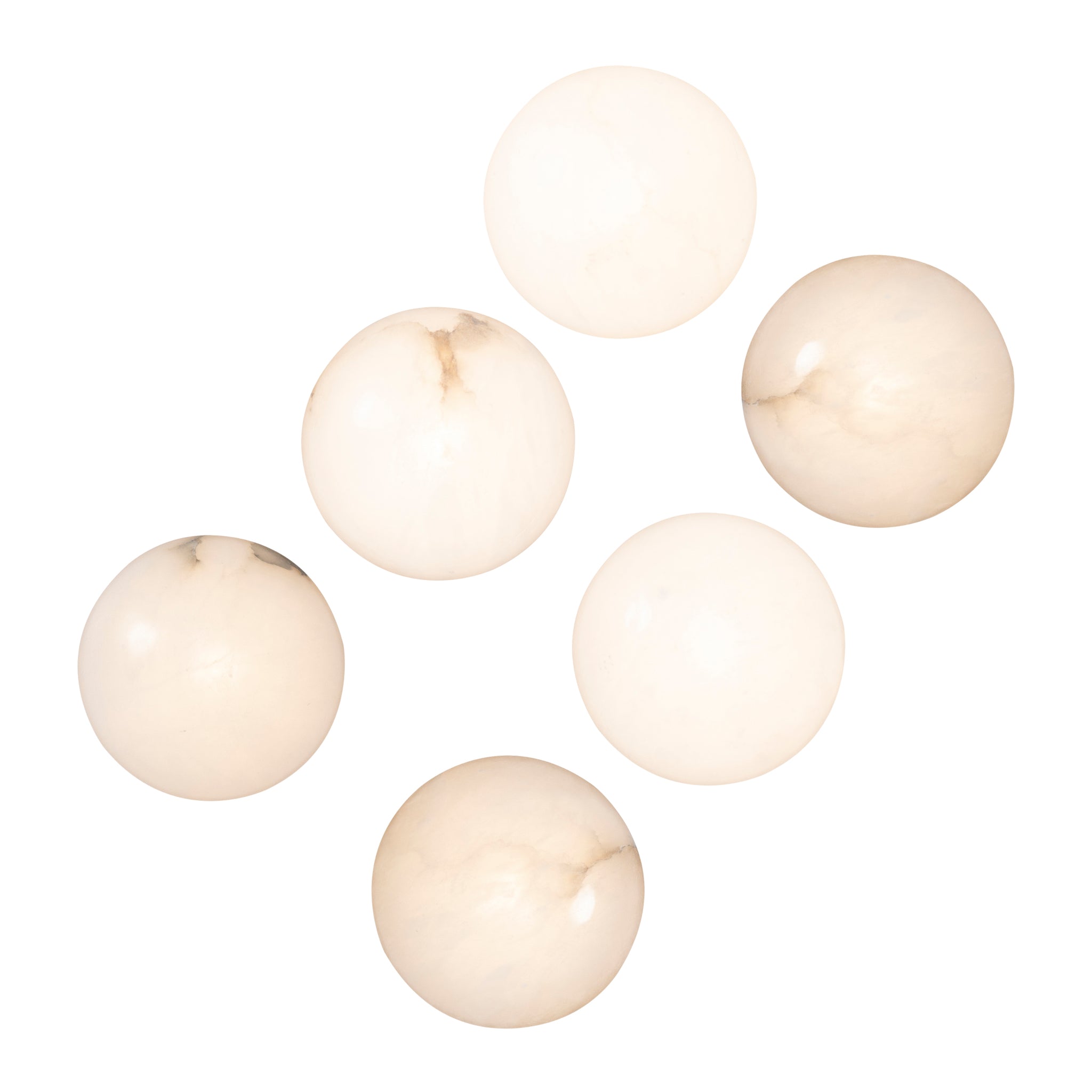 Haloa wall sconce displaying six light-colored alabaster spheres with subtle marbling.