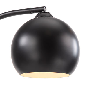 Folia Floor Lamp with a matte black spherical shade and a curved arm, showcasing a modern design.