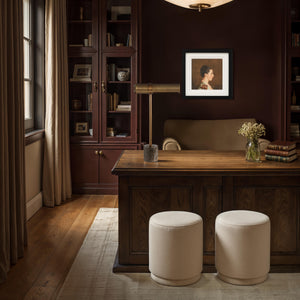Gusle Table Lamp on a wooden desk in a cozy office, surrounded by books and decorative elements.