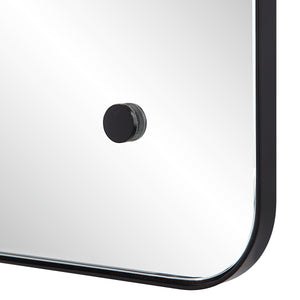 Close-up of Aine Wall Mirror's black mounting hardware and rounded edges.